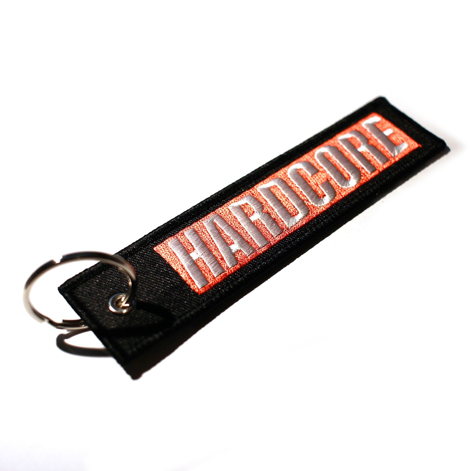Black keychain with 'HARDCORE' in White within a Red box
