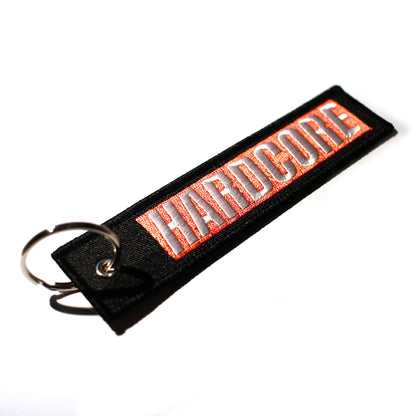 Black keychain with 'HARDCORE' in White within a Red box