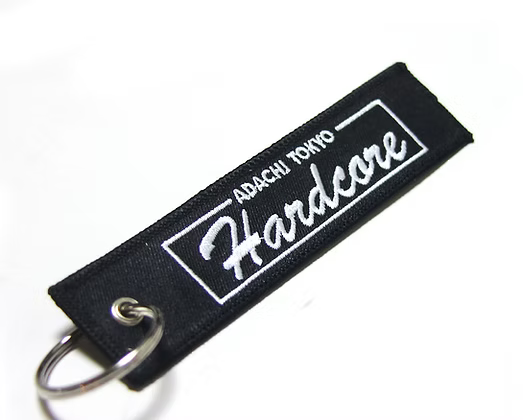 Black keychain with white text on a white background
Hardcore Tokyo Team Flight Tag